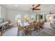 Dining area boasting bright natural light from the three arched windows with pool views at 520 74Th St, Holmes Beach, FL 34217