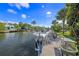Waterfront property with a private dock, lush landscaping and views of the canal at 520 74Th St, Holmes Beach, FL 34217
