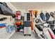 Organized garage with wall storage, including a scooter, refrigerator, and an ice maker at 520 74Th St, Holmes Beach, FL 34217