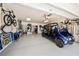 Spacious garage with vehicle, bicycles, and storage solutions, illuminated by modern lighting at 520 74Th St, Holmes Beach, FL 34217