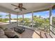 Relaxing lanai with tile flooring, sofa and furniture with serene outdoor views at 520 74Th St, Holmes Beach, FL 34217
