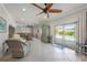 Bright open living area with tile floor, view of outdoor pool and dining area at 520 74Th St, Holmes Beach, FL 34217
