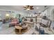 Open-concept living room with hardwood floors and view of the kitchen at 520 74Th St, Holmes Beach, FL 34217
