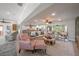 Open-concept living room with hardwood floors and ceiling fans at 520 74Th St, Holmes Beach, FL 34217