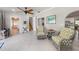 Inviting living room with tile floors, neutral walls, wicker chairs, and a ceiling fan at 520 74Th St, Holmes Beach, FL 34217