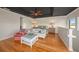 Spacious bedroom features a lounge area and king-sized bed with serene light and a tray ceiling at 520 74Th St, Holmes Beach, FL 34217
