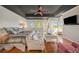 Inviting main bedroom with a tray ceiling, sitting area, and serene ambiance at 520 74Th St, Holmes Beach, FL 34217
