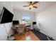 Bright office with a ceiling fan, a window with outside view, and computer setup at 520 74Th St, Holmes Beach, FL 34217