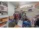 Spacious walk-in closet with wooden floors, shelving, and hanging rods for storage at 520 74Th St, Holmes Beach, FL 34217