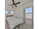 Well-lit bedroom featuring carpet, two windows, and curtain at 5232 Wishing Arch Dr, Apollo Beach, FL 33572