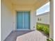 Welcoming front door with a charming blue finish and elegant brick paver entryway at 5232 Wishing Arch Dr, Apollo Beach, FL 33572