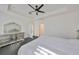 Spacious main bedroom features dark hardwood floors, ceiling fan and dresser for ample storage at 5232 Wishing Arch Dr, Apollo Beach, FL 33572
