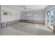 Bedroom with shuttered windows and access to water views, ready for a new design at 5451 Oakhurst Dr, Seminole, FL 33772