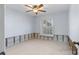 Bedroom with natural light and ceiling fan and baseboard trim at 5451 Oakhurst Dr, Seminole, FL 33772