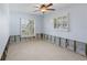 Bedroom showcasing natural light and classic plantation shutters at 5451 Oakhurst Dr, Seminole, FL 33772
