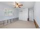 Bedroom featuring a ceiling fan, closet and window at 5451 Oakhurst Dr, Seminole, FL 33772