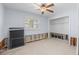 Bedroom featuring a ceiling fan, window and closet at 5451 Oakhurst Dr, Seminole, FL 33772