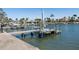 A well-maintained dock with boat lift provides easy access to the water, perfect for boating enthusiasts at 5451 Oakhurst Dr, Seminole, FL 33772