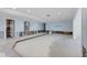 Expansive living area ready for renovation, featuring access to other rooms at 5451 Oakhurst Dr, Seminole, FL 33772