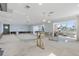 Open-concept living space with recessed lighting and water views awaiting transformation at 5451 Oakhurst Dr, Seminole, FL 33772