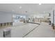 Spacious living room with large windows offering waterfront views, awaiting remodel at 5451 Oakhurst Dr, Seminole, FL 33772
