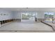 Bright living room with water views and sliding glass doors, needing renovation at 5451 Oakhurst Dr, Seminole, FL 33772
