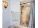 Bathroom with updated shower featuring tiled walls, unique tile flooring and neutral paint at 5900 Bahia Del Mar Cir # 137, St Petersburg, FL 33715