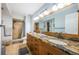 Spacious bathroom with double sinks, granite countertops, and a walk-in shower at 5900 Bahia Del Mar Cir # 137, St Petersburg, FL 33715