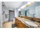 Spacious bathroom featuring a double vanity with granite counters and walk-in shower at 5900 Bahia Del Mar Cir # 137, St Petersburg, FL 33715