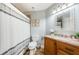 Well-lit bathroom with a decorative mirror and granite countertop vanity at 5900 Bahia Del Mar Cir # 137, St Petersburg, FL 33715