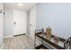 Bright entryway with tile flooring, white door, and decorative furnishings at 5900 Bahia Del Mar Cir # 137, St Petersburg, FL 33715