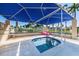 Inviting hot tub featuring an overhead shade structure and views of the surrounding tropical community at 5900 Bahia Del Mar Cir # 137, St Petersburg, FL 33715