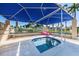 Inviting hot tub featuring an overhead shade structure and views of the surrounding tropical community at 5900 Bahia Del Mar Cir # 137, St Petersburg, FL 33715