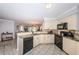 Bright kitchen with granite countertops, stainless steel appliances, and tiled floor plan at 5900 Bahia Del Mar Cir # 137, St Petersburg, FL 33715
