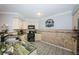 Stylish kitchen with granite countertops and cream colored cabinetry at 5900 Bahia Del Mar Cir # 137, St Petersburg, FL 33715