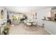 Bright living room features tile flooring, dining table, and access to outdoor space at 5900 Bahia Del Mar Cir # 137, St Petersburg, FL 33715