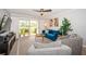 Bright living room with sliding glass doors opening to a furnished patio at 5900 Bahia Del Mar Cir # 137, St Petersburg, FL 33715