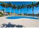 Beautiful outdoor pool area with inviting lounge chairs and tall palm trees at 5900 Bahia Del Mar Cir # 137, St Petersburg, FL 33715