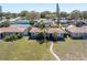 An aerial view displays a well-kept property with mature landscaping and a sprawling green lawn at 6618 3Rd N Ave, St Petersburg, FL 33710
