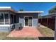 Backyard patio with sliding glass doors, leading to the home's interior, and an air conditioning unit at 6618 3Rd N Ave, St Petersburg, FL 33710