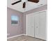 Bedroom featuring light floors, a double closet and a window providing ample natural light at 6618 3Rd N Ave, St Petersburg, FL 33710
