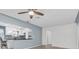 Modern kitchen with stainless steel appliances, white cabinetry, and a decorative tile backsplash at 6618 3Rd N Ave, St Petersburg, FL 33710