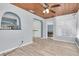 Open floor plan with wood ceiling and archways to the kitchen at 6618 3Rd N Ave, St Petersburg, FL 33710
