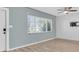 Bright living room with light-colored walls, wood floors, and abundant natural light at 6618 3Rd N Ave, St Petersburg, FL 33710
