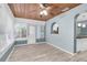 The sunroom has natural light, wood ceiling, and laminate floors at 6618 3Rd N Ave, St Petersburg, FL 33710