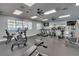 Community gym featuring treadmills, elliptical machines, stationary bikes, and tv at 7100 Islamorada Cir, Seminole, FL 33777