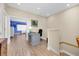 Neutral toned home office with modern desk, chair, and wood-look flooring at 7100 Islamorada Cir, Seminole, FL 33777