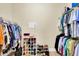 Organized walk-in closet with rods, shelves, and a shoe rack at 7100 Islamorada Cir, Seminole, FL 33777