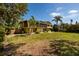 Large backyard features mature trees providing shade and privacy at 724 69Th S Ave, St Petersburg, FL 33705