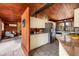 Open kitchen featuring stainless steel appliances and wood ceilings opening to the living area at 724 69Th S Ave, St Petersburg, FL 33705